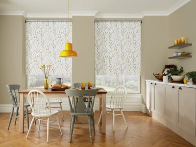 Contemporary white roller blind in a bright living space